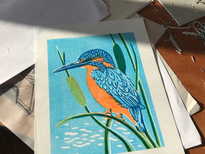 A Barle river kingfisher captured in linocut at Knapp House creative Luna North course